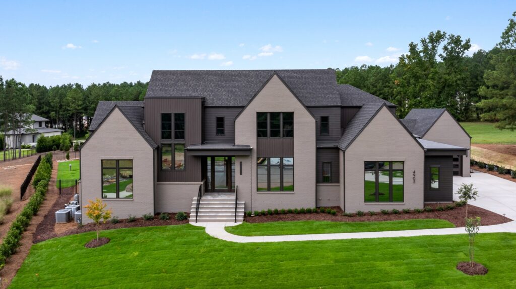 Front elevation with dark roofline at A Lasting Legacy, a custom home built by Loyd Builders in Raleigh, NC