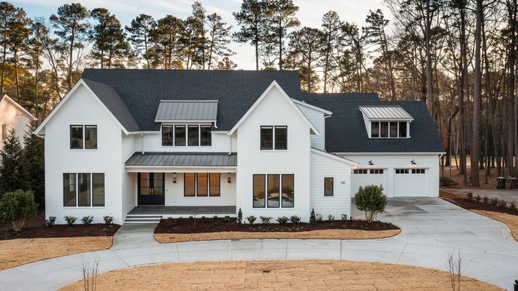 Front Elevation of White Modern Farmhouse at Light & Land, a custom home built by Loyd Builders in Cary, NC