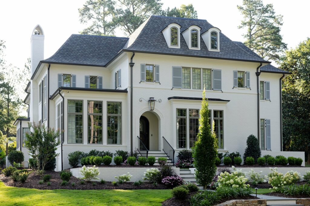 Front Elevation of White French Manor at Maison Grant, a custom home built by Loyd Builders in Raleigh, NC