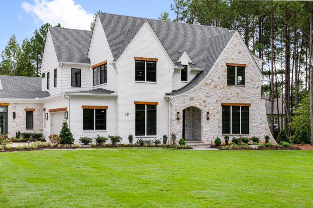 Front Elevation with Stone and White Brick at The New Classic, a custom home built by Loyd Builders in North Carolina