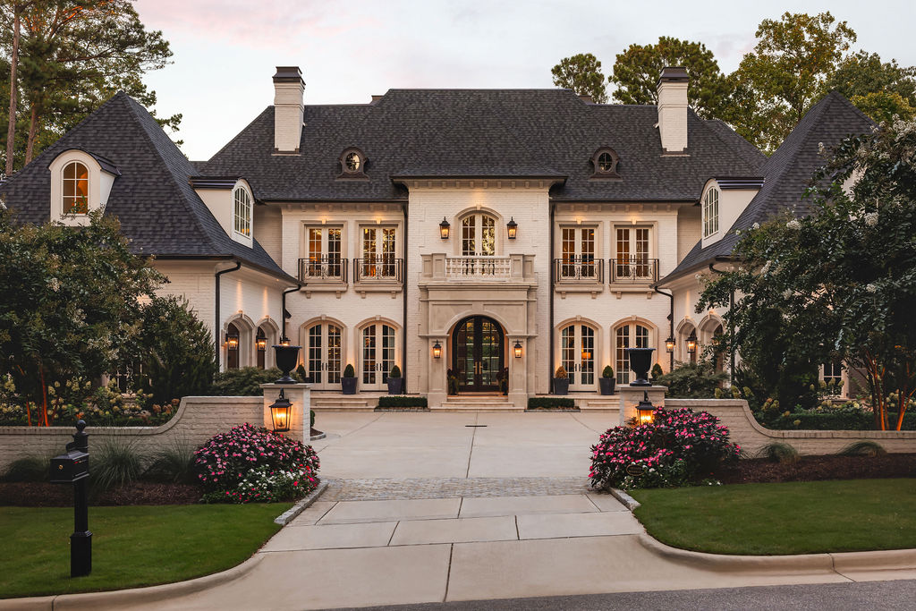 Front Exterior of the French Manor with Slate Mansard Roof at Crescent Manor, a custom home built by Loyd Builders in Raleigh, NC